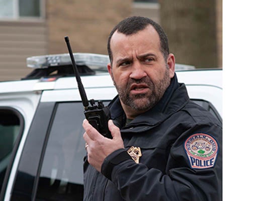 Norwalk police officer using portable radio