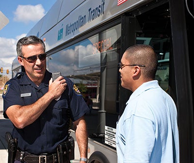 Public Safety Officer with Radio at Bus Terminal