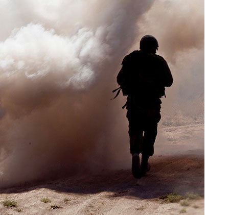 soldier obscured by smoke