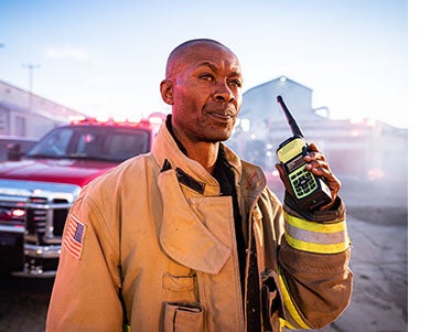 Firefighter with NFPA 1802 compliant XL Extreme portable radio