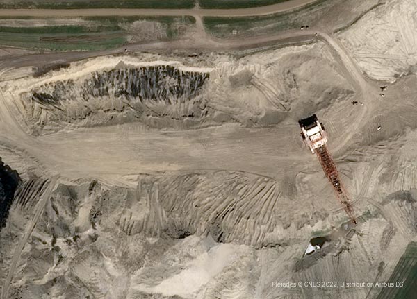 Monitoring Mining Operations with Correlated Geospatial Datasets