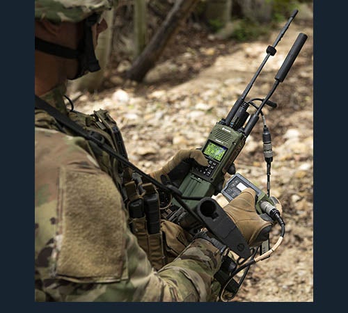 U.S. Army Special Forces soldier using PRC-163 radio