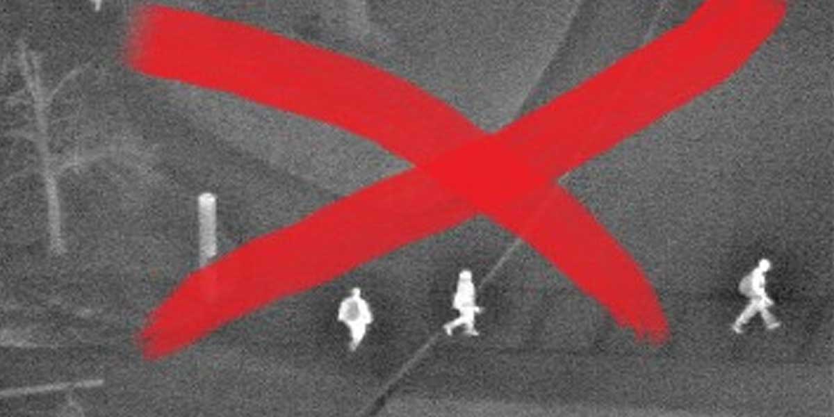 Infrared image of people fleeing with an X on it