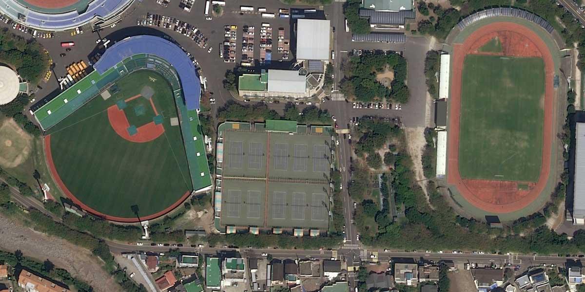 Geospatial Satellite Imagery - Aerial of a city that includes a baseball field and football field