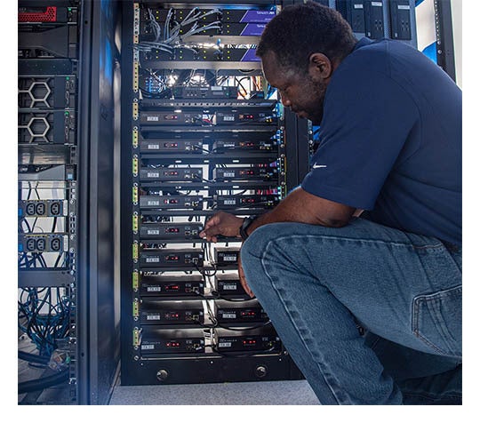 IT technician working on server