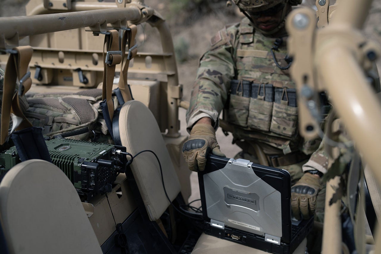 Solider using laptop on NGC2 network