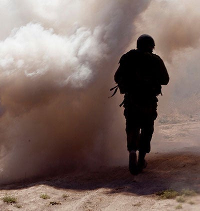 soldier obscured by smoke