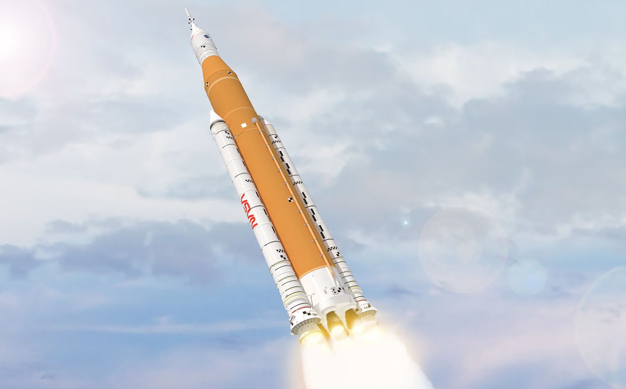 SLS rockets through clouds