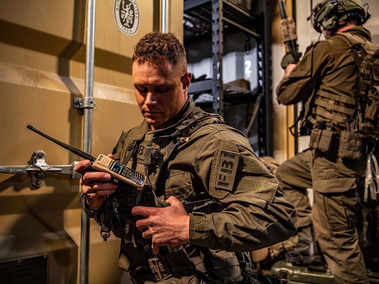 FBI agent with portable radio