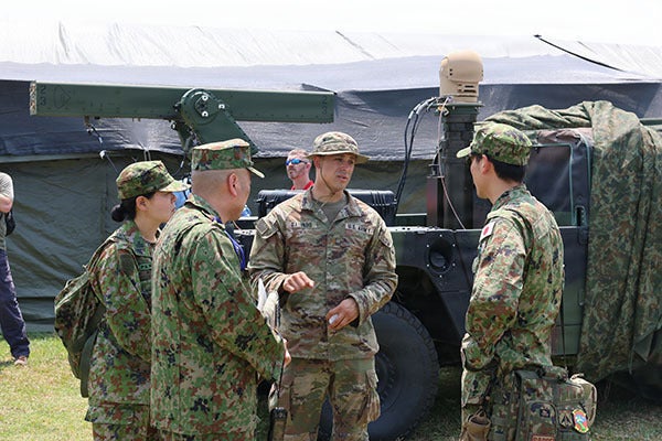 A U.S. Army officer discusses the advantages of VAMPIRE with members of the Japan Ground Self-Defense Force, during Exercise Balikatan 2026