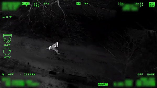 Running man as seen from WESCAM MX-10 electro-optical/infrared sensor system for airborne law enforcement