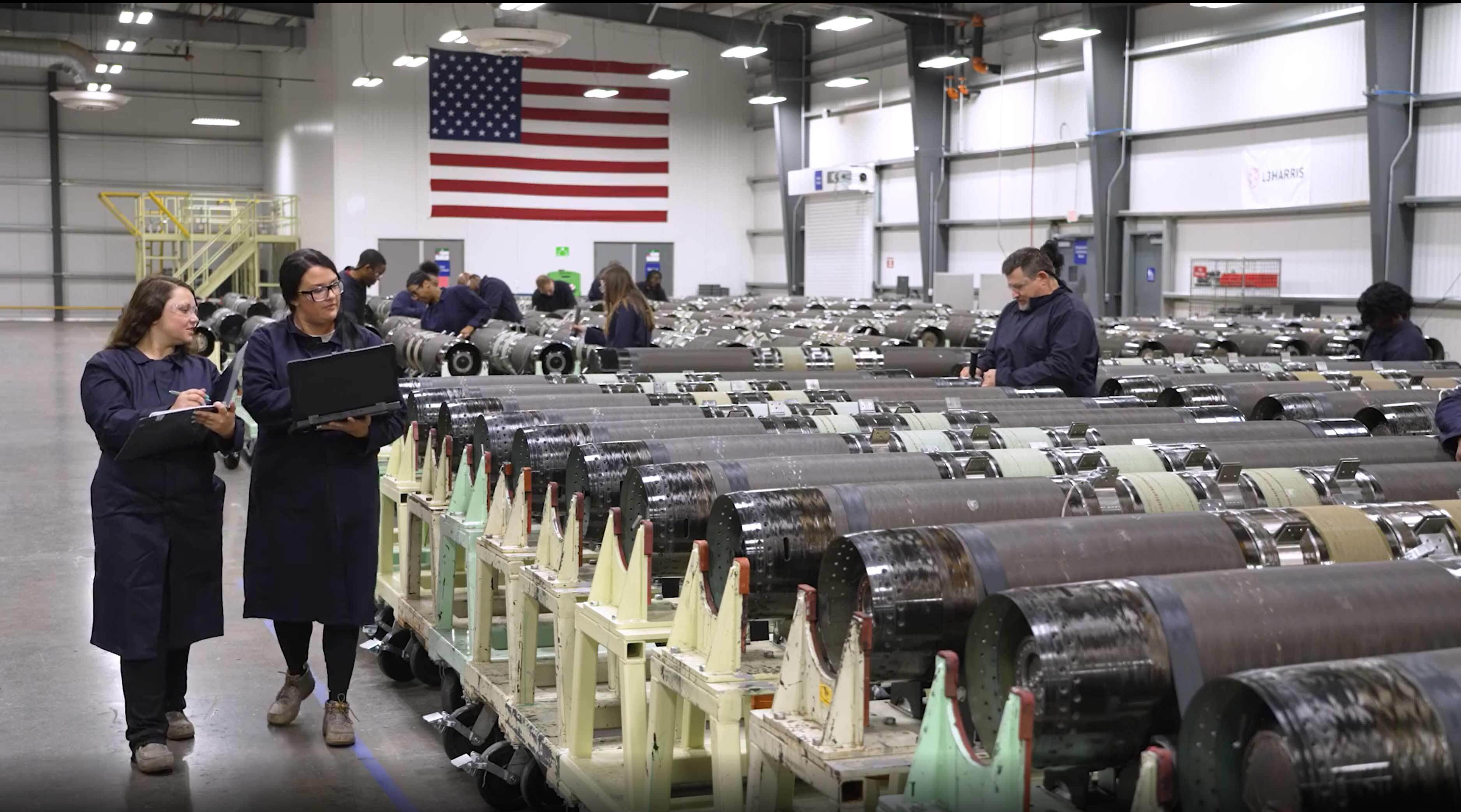 Workers walking through Camden. Arkansas SRM facility.