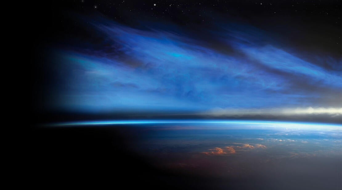 Blue clouds hover over a horizon