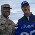 L3Harris and US Air Force soldiers celebrating falcon football game