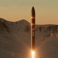 Missile launches with mountains in background