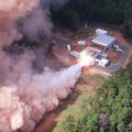 Rocket motor test fires in a forest