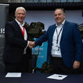Executives from L3Harris and Thales UK shake hands