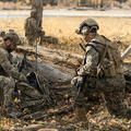 Joint forces warfighters with communications equipment