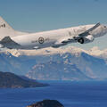 P-8A flies over mountain range