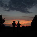 Soldiers wearing helmet-mounted night vision at dusk