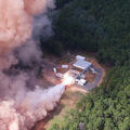 A solid rocket motor test fires at a facility