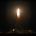 Rocket launches in night sky