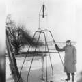 Dr. Robert H. Goddard and a liquid oxygen-gasoline rocket in the frame from which it was fired on March 16, 1926, at Auburn, Massachusetts. Credit: NASA