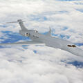 L3Harris' concept graphic of the right side, forward view of the AERIS X Bombardier Global 6500 Variant in flight with sky and cloud background thumbnail image
