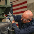 An L3Harris employee works on the company's new high-volume production line for VAMPIRE™