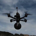Still frame from Fiber-Optic Tether products video, flying drone with tether pack