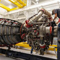 Employees work on an RS-25 engine