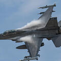 An F-16 Fighting Falcon with the Minnesota National Guard soars through the air above Duluth, Minn.