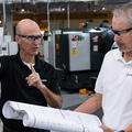 Greg Burns, Director of Operations, L3Harris Canoga Park Site (L) and Pat O’Kelley, L3Harris Canoga Park Site Lead (R), discuss expansion plans.