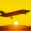 F-35 takes off from tarmac at sunrise