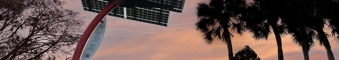 Solar panel outside of a L3Harris facility at dusk