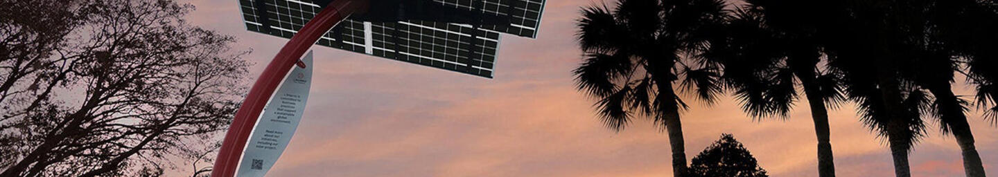 Solar panel outside of a L3Harris facility at dusk