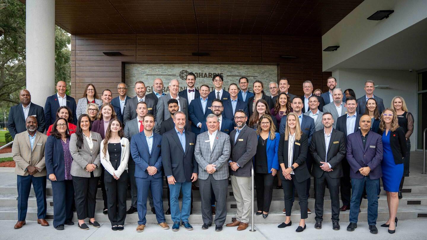 Group of leaders and employees gathered for awards ceremony