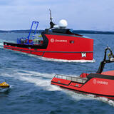 three uncrewed Surface Vehicles at sea