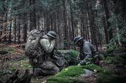 Polish soldiers on tactical comms in forest