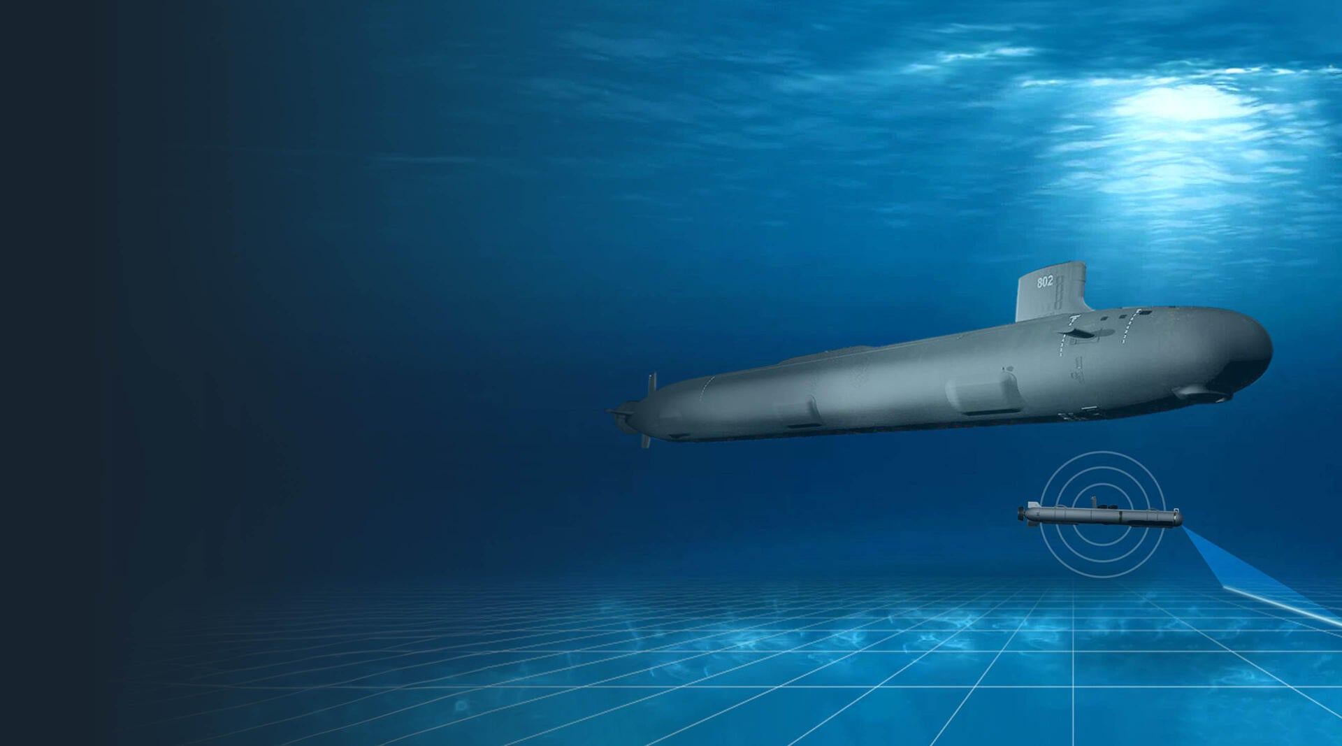 A submarine glides underneath a surface