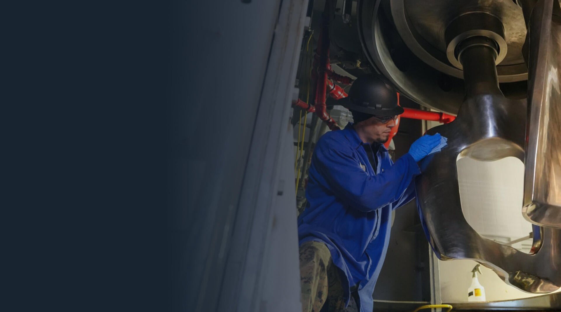 A worker in Orange, Virginia working on solid rocket motor machinery