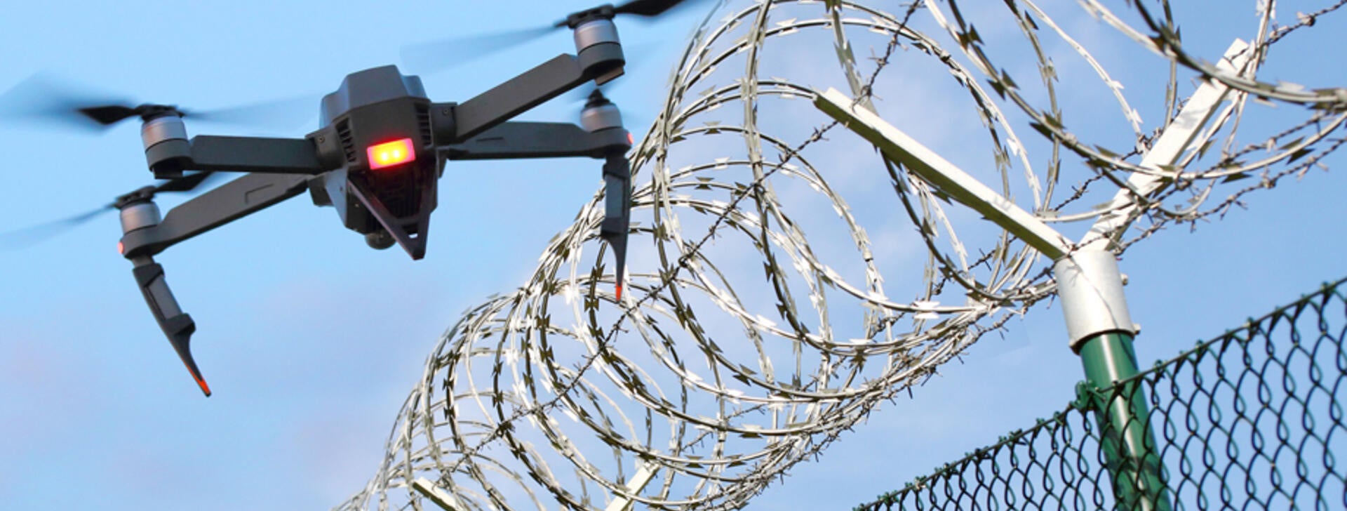 enemy drone hovering over fence