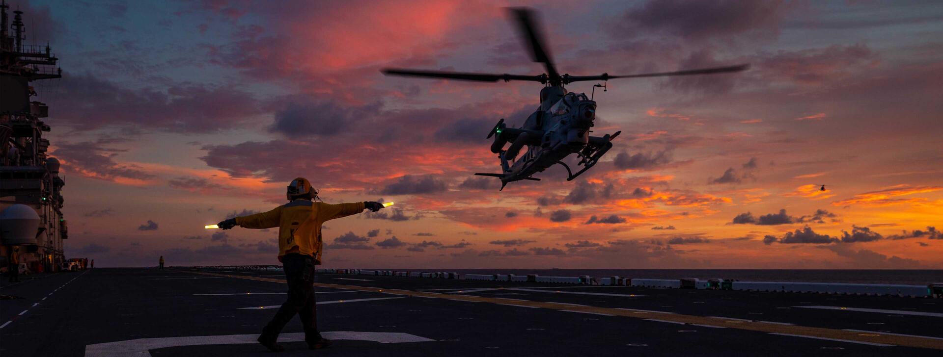 Helicopter guided to landing  (U.S. Navy photo by Mass Communication Specialist 3rd Class Jesse Schwab)