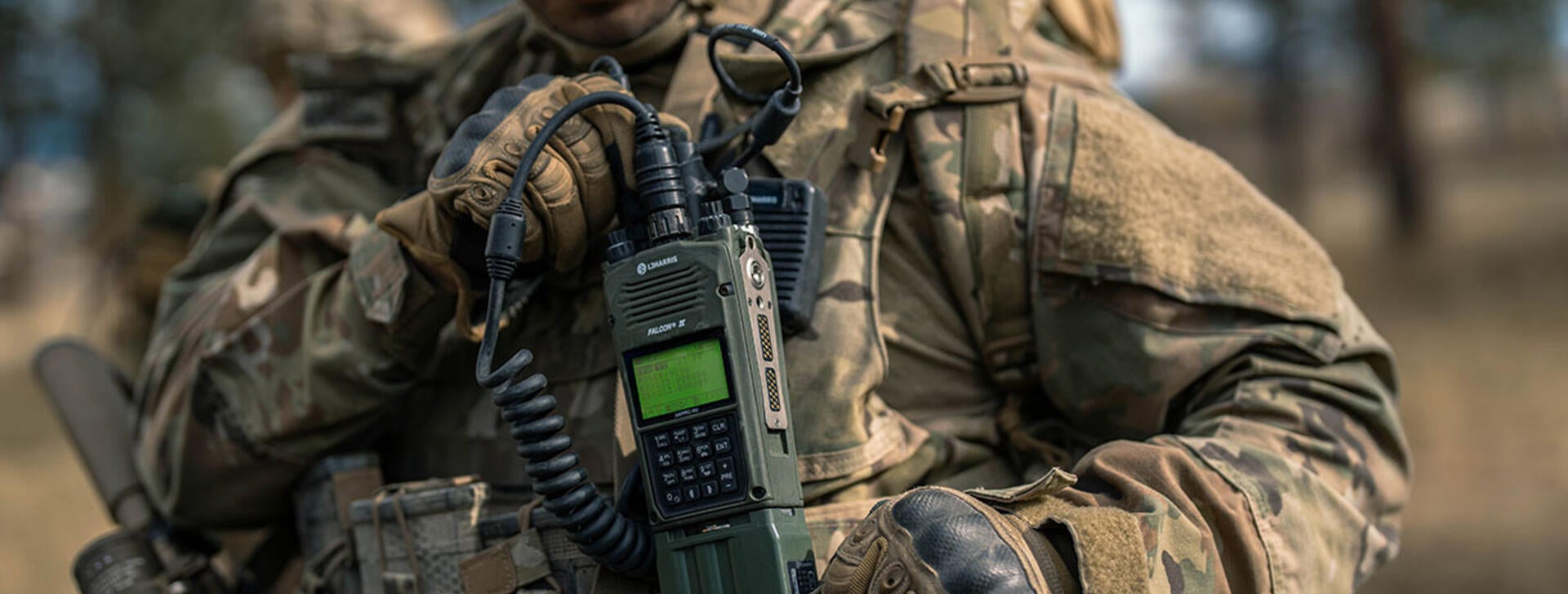 Joint Forces soldier with AN/PRC-163 handheld radio