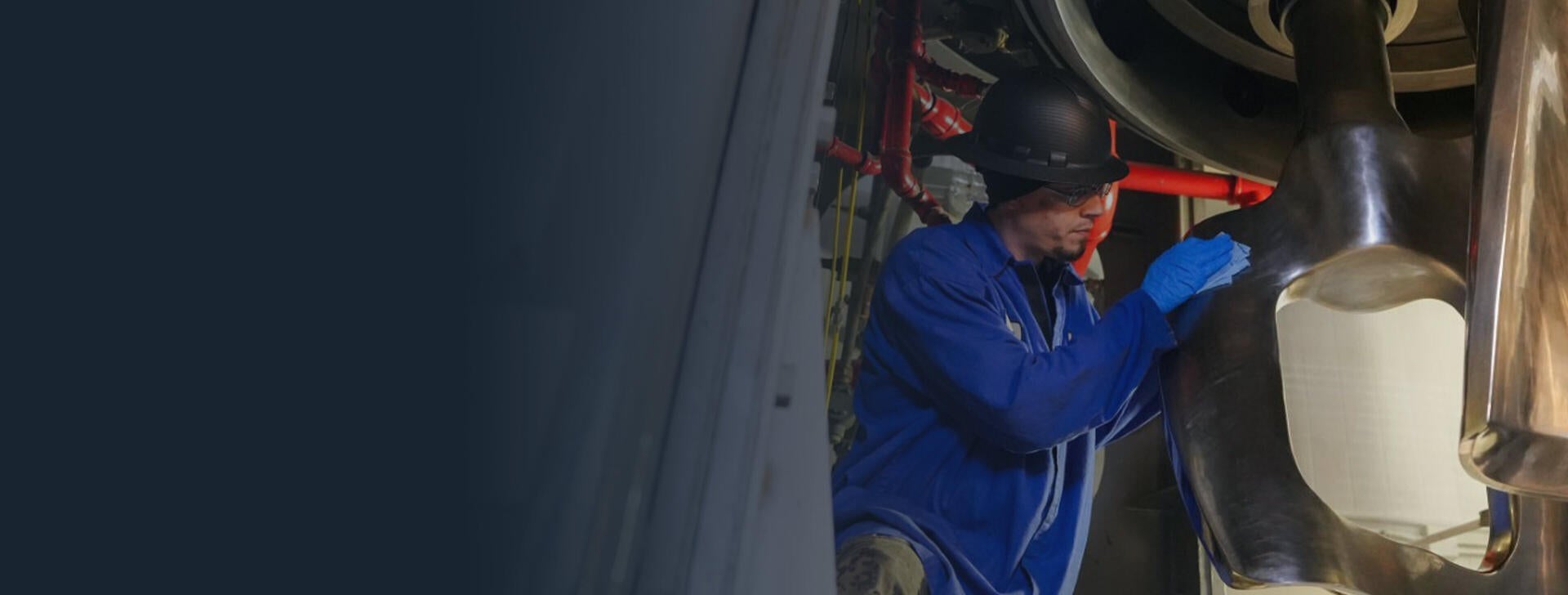 A worker in Orange, Virginia working on solid rocket motor machinery