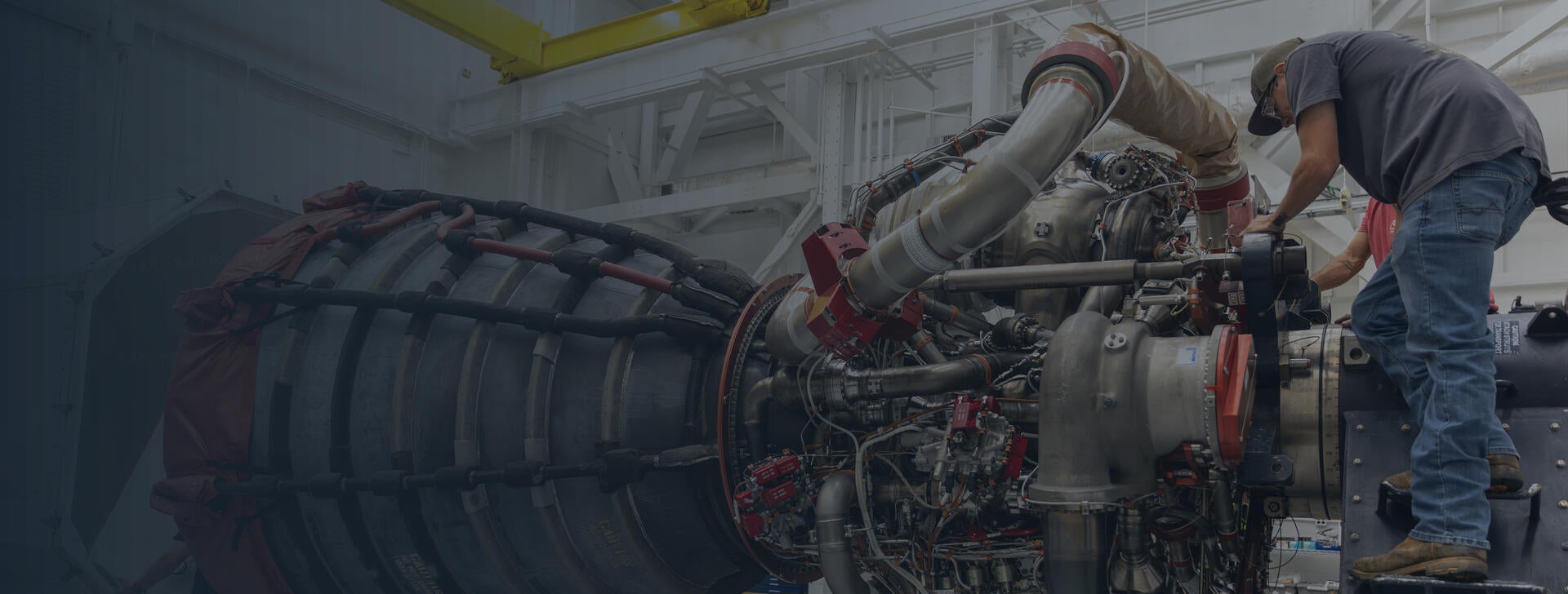 Employees work on an RS-25 engine