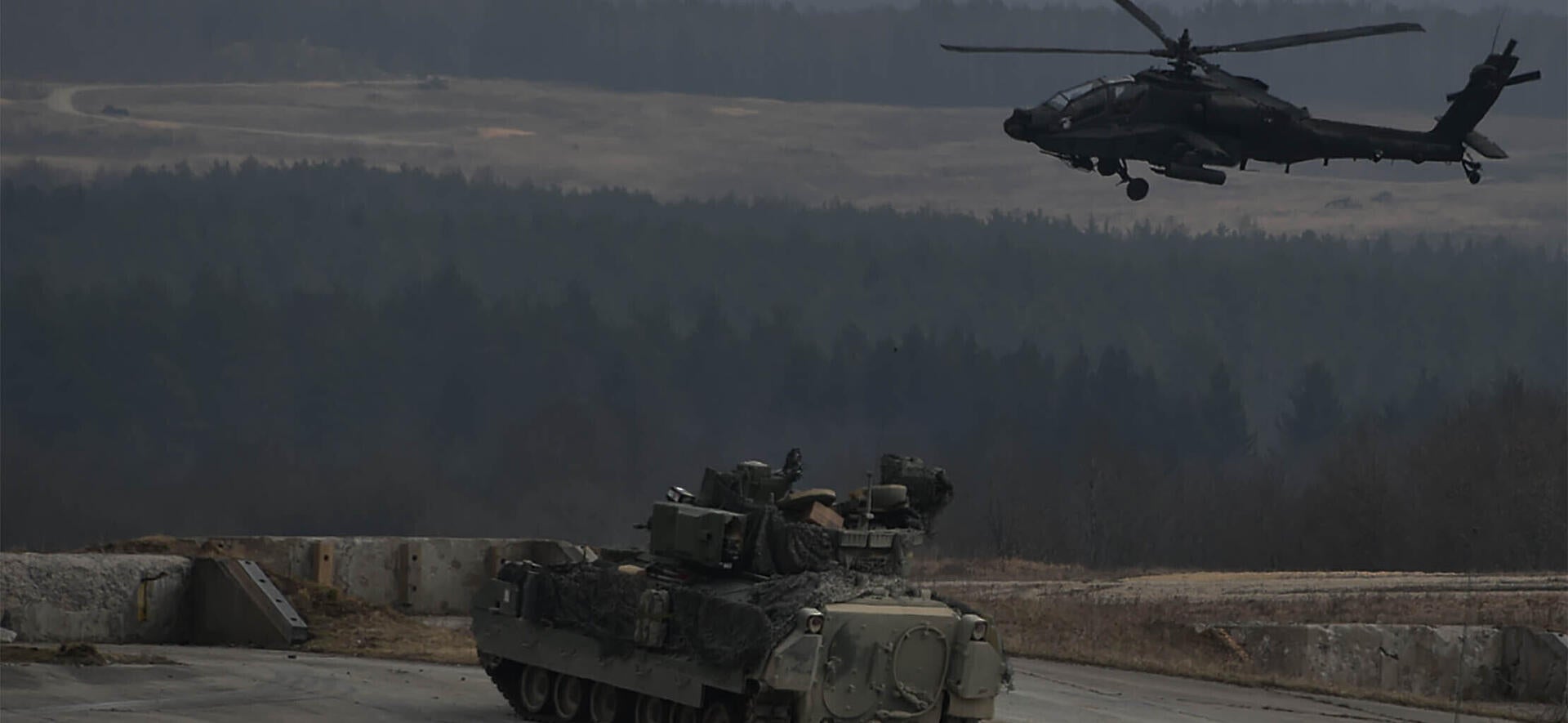 Helicopter and armored vehicle