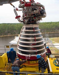 NASA Stennis teams conducted a successful lift onto the Fred Haise Test Stand of RS-25 engine No. E20001, the first of 24 new production engines. Photo credit: NASA Stennis.