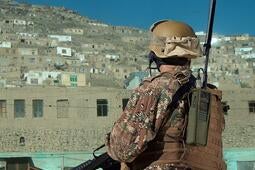 Soldier wearing handheld Falcon® Radio