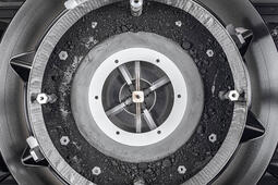 A top-down view of the OSIRIS-REx sample container with the lid removed, revealing the remainder of the asteroid sample inside. Photo: NASA/Erika Blumenfeld &amp; Joseph Aebersold